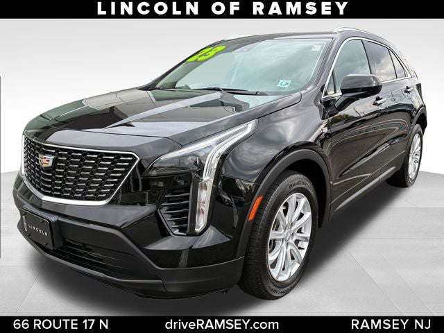 2023 Cadillac XT4 Luxury in Stellar Black Metallic — front three-quarter view